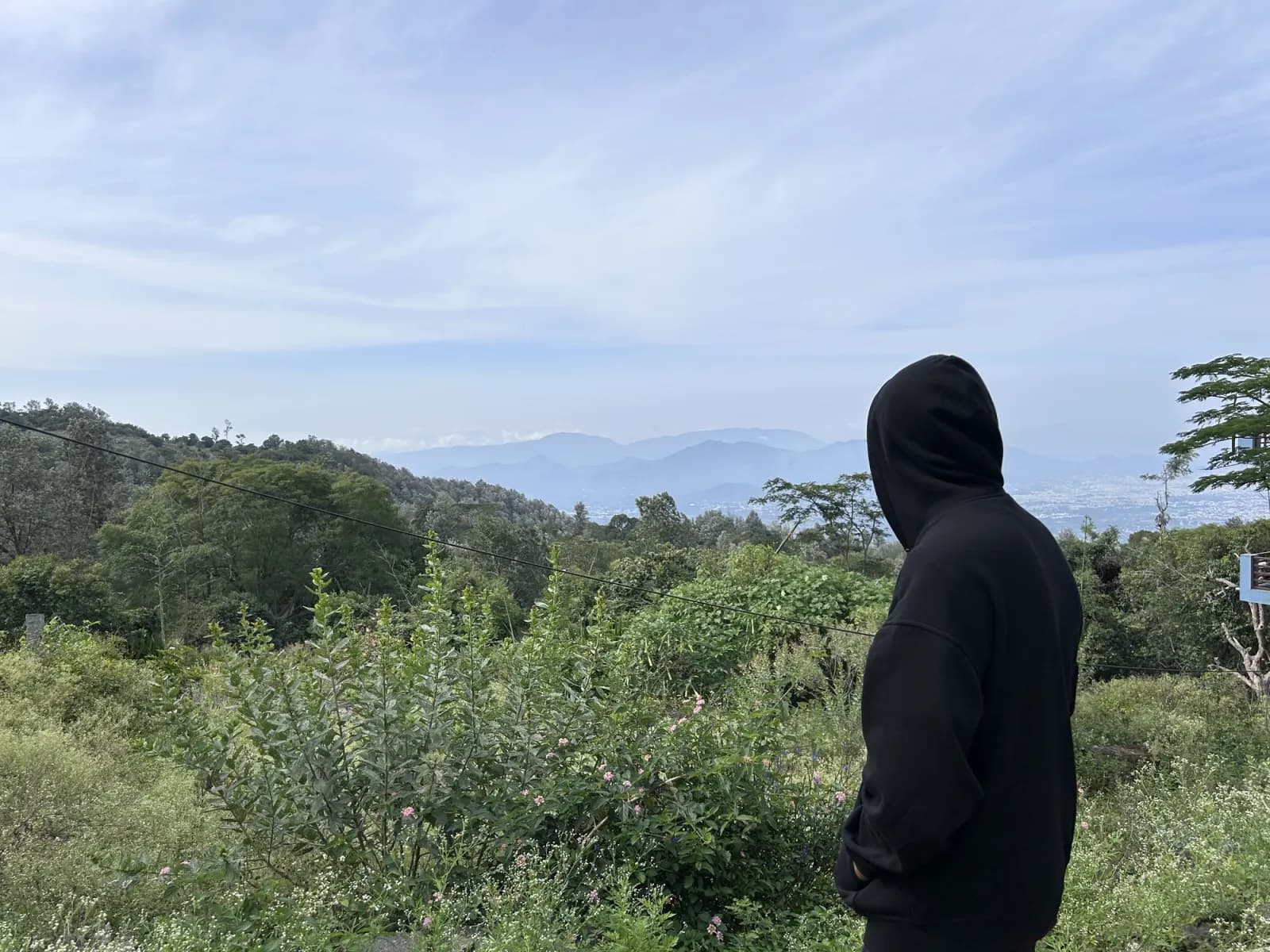 Looking out over hazy blue hills from a ridge at Yercaud